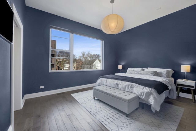 3056 N Monticello Ave, Chicago, IL 60618 - bedroom featuring baseboards and wood finished floors