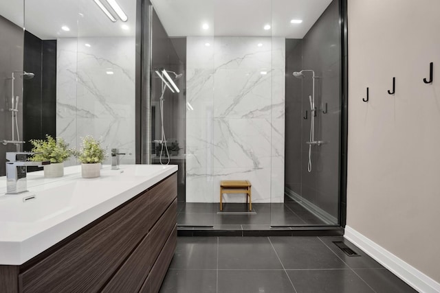 3056 N Monticello Ave, Chicago, IL 60618 - bathroom featuring a marble finish shower, double vanity, tile patterned floors, and recessed lighting