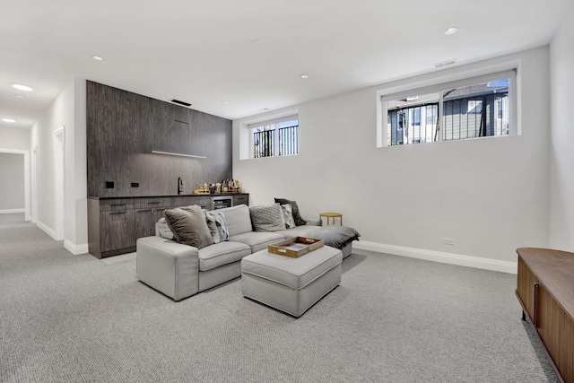3056 N Monticello Ave, Chicago, IL 60618 - living room with light carpet, bar area, baseboards, and recessed lighting