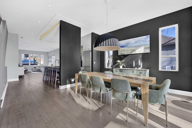 3056 N Monticello Ave, Chicago, IL 60618 - dining area with dark wood-style flooring and baseboards