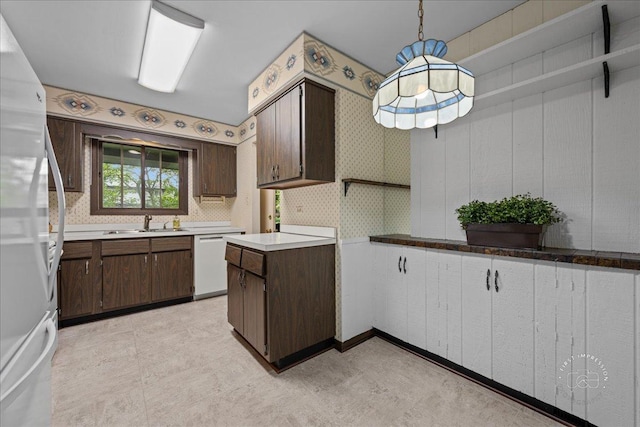 1508 Blackburn St, Wheaton, IL 60189 - kitchen featuring white appliances, a sink, dark brown cabinets, light flooring, and wallpapered walls