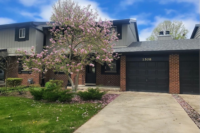 1508 Blackburn St, Wheaton, IL 60189 - view of front of house with board and batten siding, brick siding, concrete driveway, and an attached garage