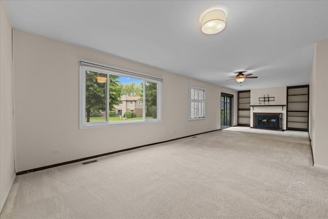 1508 Blackburn St, Wheaton, IL 60189 - unfurnished living room with carpet floors, a ceiling fan, baseboards, and a glass covered fireplace