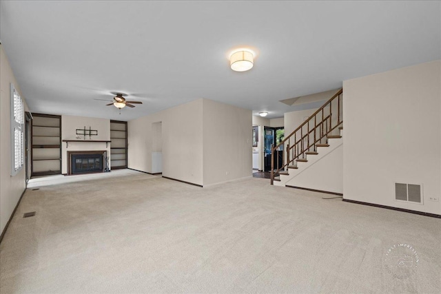 1508 Blackburn St, Wheaton, IL 60189 - unfurnished living room with baseboards, ceiling fan, carpet flooring, stairway, and a glass covered fireplace