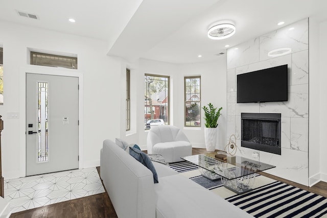 6610 S Saint Lawrence Ave, Chicago, IL 60637 - living room featuring a fireplace, recessed lighting, baseboards, and wood finished floors