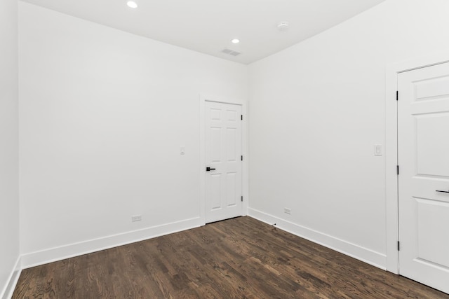 6610 S Saint Lawrence Ave, Chicago, IL 60637 - empty room featuring dark wood-type flooring, baseboards, and recessed lighting