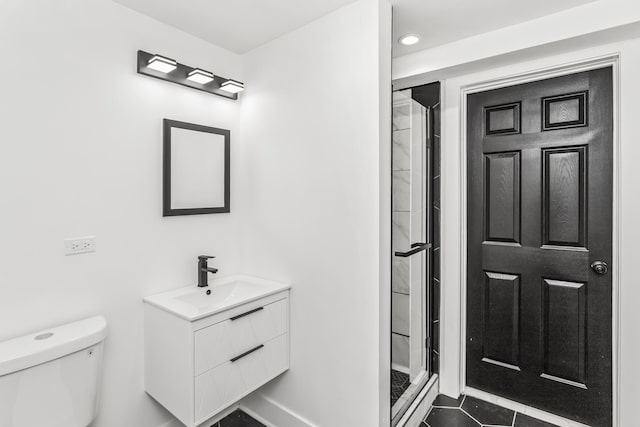 6610 S Saint Lawrence Ave, Chicago, IL 60637 - bathroom with vanity, a shower stall, toilet, tile patterned flooring, and recessed lighting