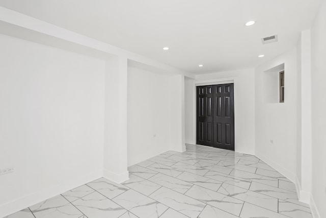 6610 S Saint Lawrence Ave, Chicago, IL 60637 - spare room featuring light marble finish flooring, recessed lighting, and baseboards