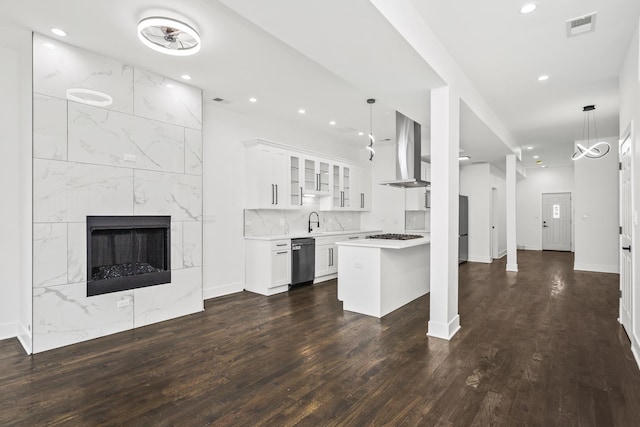 6610 S Saint Lawrence Ave, Chicago, IL 60637 - kitchen with wall chimney exhaust hood, open floor plan, glass insert cabinets, light countertops, and dark wood finished floors