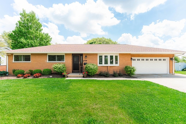 854 Meadow Ln, Sycamore, IL 60178 - single story home featuring an attached garage, brick siding, concrete driveway, and a front lawn