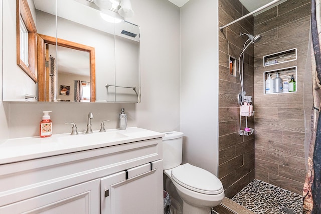 854 Meadow Ln, Sycamore, IL 60178 - full bathroom featuring toilet, a tile shower, and vanity