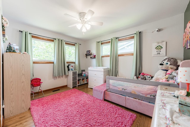 854 Meadow Ln, Sycamore, IL 60178 - bedroom featuring wood finished floors, ceiling fan, and baseboards