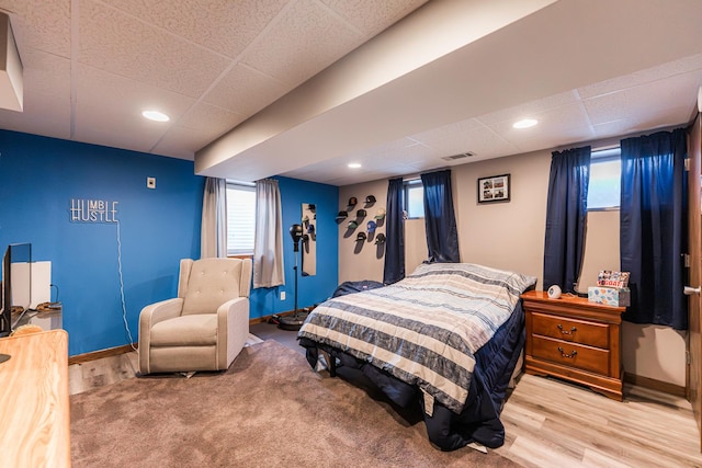 854 Meadow Ln, Sycamore, IL 60178 - bedroom featuring a paneled ceiling, wood finished floors, and baseboards