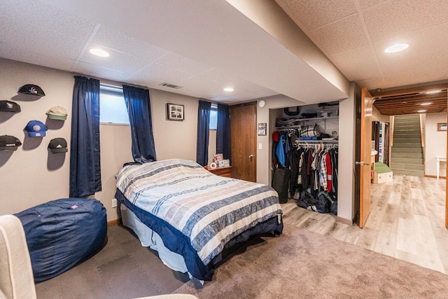 854 Meadow Ln, Sycamore, IL 60178 - bedroom with a drop ceiling, light wood-type flooring, a closet, and baseboards