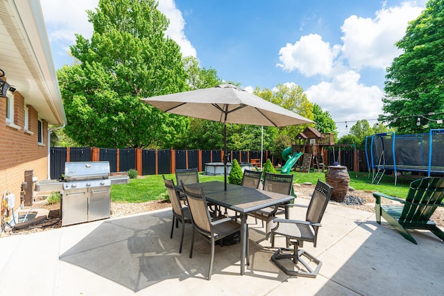 854 Meadow Ln, Sycamore, IL 60178 - view of patio with a trampoline, area for grilling, a playground, and outdoor dining area