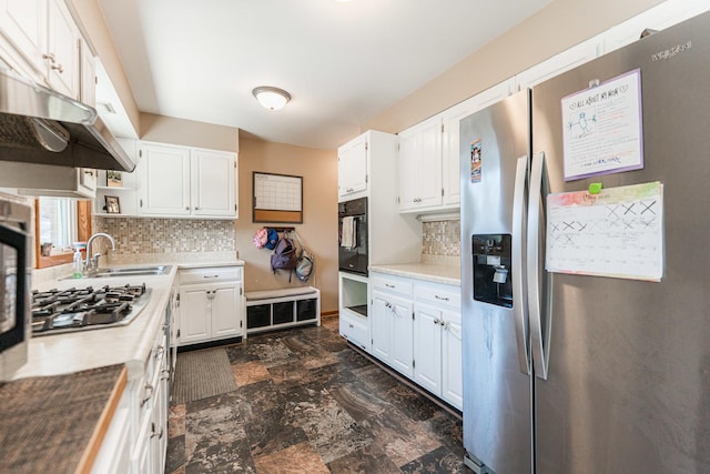 854 Meadow Ln, Sycamore, IL 60178 - kitchen with appliances with stainless steel finishes, a sink, tasteful backsplash, and white cabinets