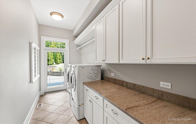 7N627 E Drive S, Elgin, IL 60177 - laundry room featuring washer and dryer, cabinet space, baseboards, and light tile patterned floors