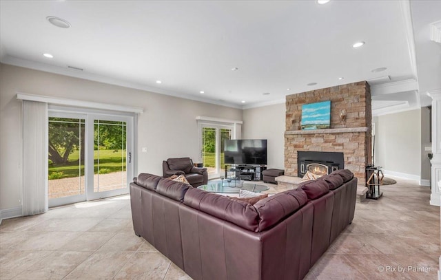 7N627 E Drive S, Elgin, IL 60177 - living room featuring crown molding, recessed lighting, a stone fireplace, light tile patterned floors, and baseboards