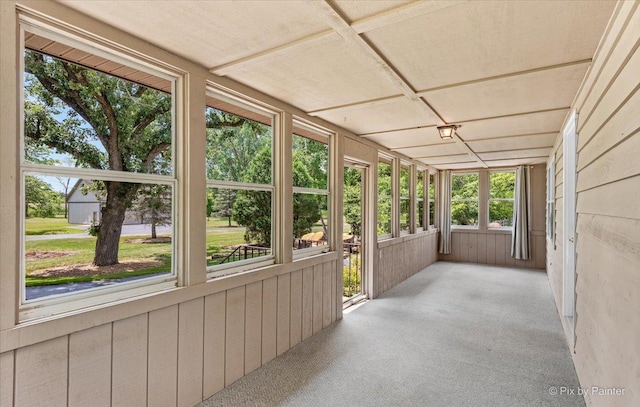 7N627 E Drive S, Elgin, IL 60177 - unfurnished sunroom featuring carpet floors and wooden walls