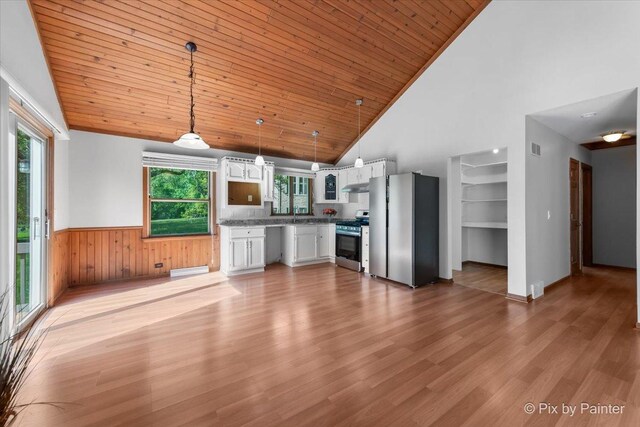7N627 E Drive S, Elgin, IL 60177 - unfurnished living room with high vaulted ceiling, a wainscoted wall, light wood-style floors, a baseboard radiator, and wooden ceiling
