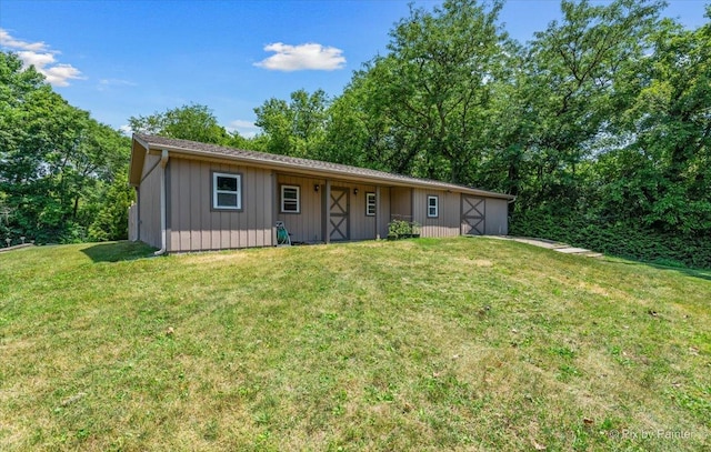 7N627 E Drive S, Elgin, IL 60177 - ranch-style house with a front yard and board and batten siding