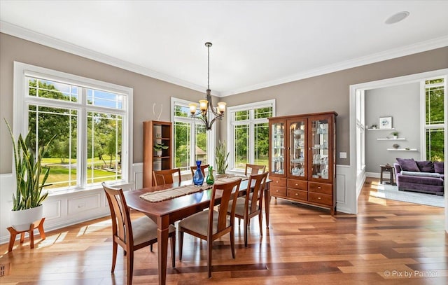 7N627 E Drive S, Elgin, IL 60177 - dining space with plenty of natural light, light wood-type flooring, a chandelier, and ornamental molding