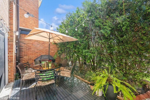 1116 S New Wilke Rd Unit 107, Arlington Heights, IL 60005 - deck featuring outdoor dining area and a grill