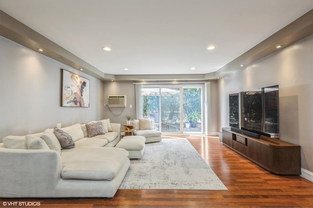 1116 S New Wilke Rd Unit 107, Arlington Heights, IL 60005 - living room featuring wood finished floors, a wall mounted AC, and recessed lighting