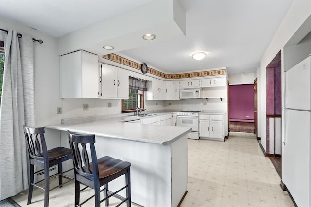 208 Ridge St, Algonquin, IL 60102 - kitchen with white appliances, light flooring, a sink, a peninsula, and light countertops