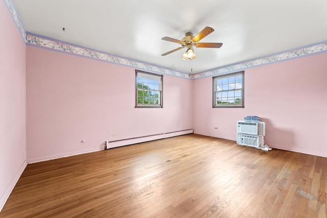 208 Ridge St, Algonquin, IL 60102 - spare room with a baseboard radiator, healthy amount of natural light, a ceiling fan, and wood finished floors