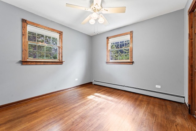 208 Ridge St, Algonquin, IL 60102 - empty room featuring a baseboard radiator, hardwood / wood-style flooring, ceiling fan, and baseboards