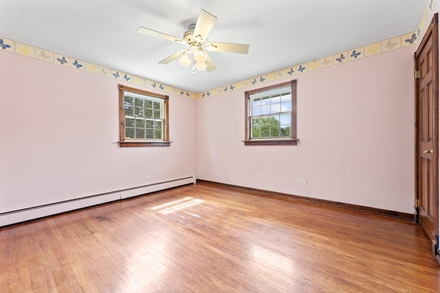 208 Ridge St, Algonquin, IL 60102 - unfurnished room with a baseboard radiator, plenty of natural light, light wood-style flooring, and ceiling fan