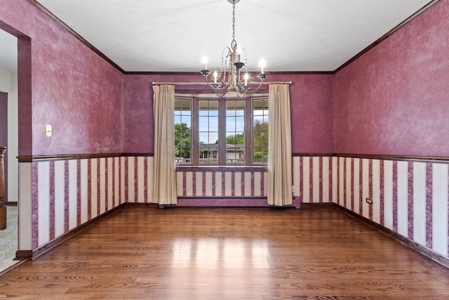 208 Ridge St, Algonquin, IL 60102 - unfurnished room with wood finished floors, a chandelier, wallpapered walls, ornamental molding, and a baseboard heating unit