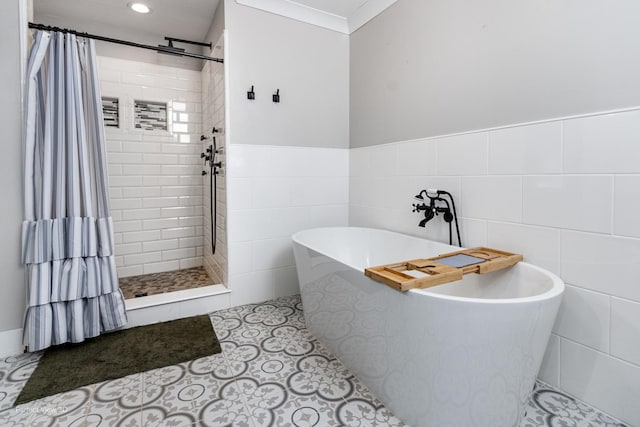 340 S Francis St, Braidwood, IL 60408 - bathroom featuring tiled shower, tile walls, a freestanding tub, tile patterned flooring, and recessed lighting
