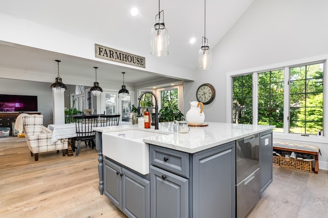 340 S Francis St, Braidwood, IL 60408 - kitchen with gray cabinetry, a sink, light wood-style flooring, open floor plan, and lofted ceiling