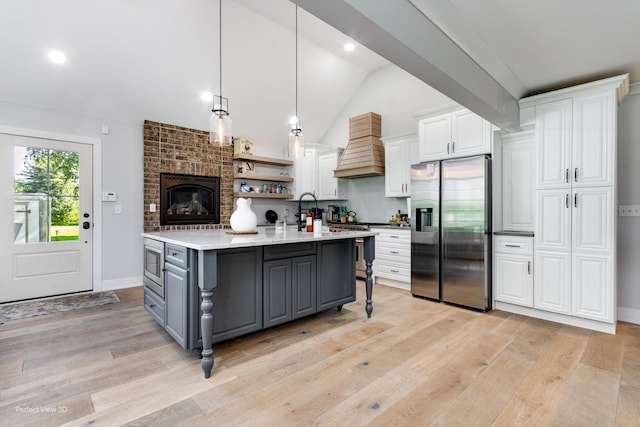 340 S Francis St, Braidwood, IL 60408 - kitchen featuring stainless steel appliances, gray cabinets, custom range hood, white cabinetry, and vaulted ceiling
