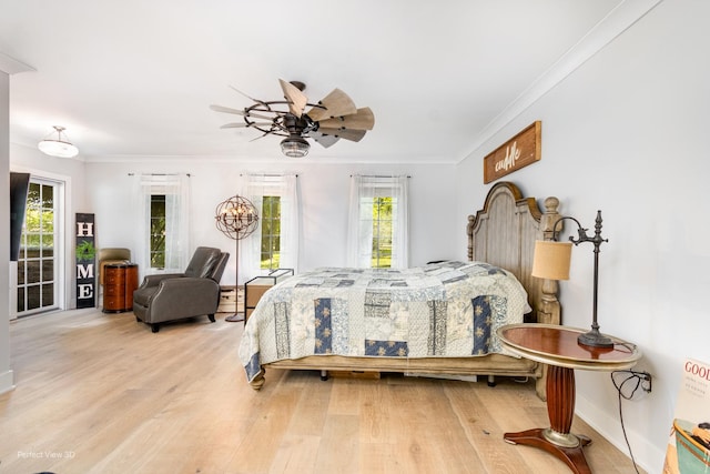 340 S Francis St, Braidwood, IL 60408 - bedroom with ornamental molding, multiple windows, light wood-type flooring, baseboards, and ceiling fan