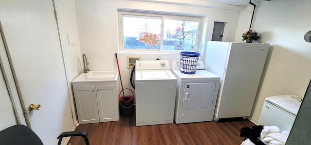 5644 Lyons St, Morton Grove, IL 60053 - laundry room with dark wood finished floors, washing machine and dryer, and cabinet space