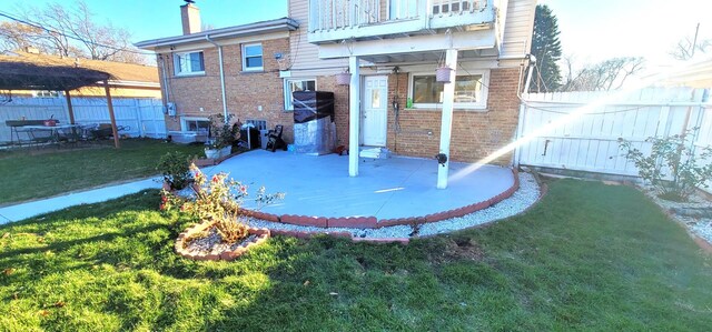 5644 Lyons St, Morton Grove, IL 60053 - rear view of property with a patio area, brick siding, a chimney, and a balcony