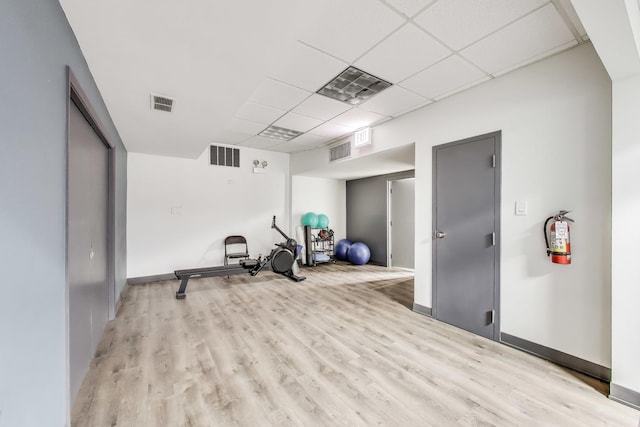 1440 N Lake Shore Dr Unit 4Bd, Chicago, IL 60610 - exercise room featuring light wood-type flooring and a paneled ceiling