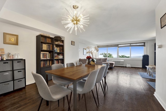 1440 N Lake Shore Dr Unit 4Bd, Chicago, IL 60610 - dining space with a chandelier, dark wood-type flooring, and radiator heating unit