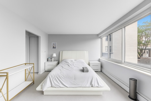 1440 N Lake Shore Dr Unit 4Bd, Chicago, IL 60610 - carpeted bedroom featuring multiple windows and a baseboard heating unit