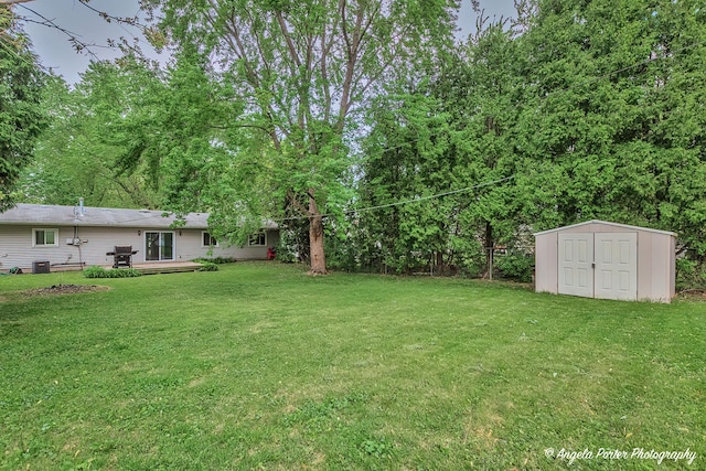 1708 Meadow Ln, Mchenry, IL 60050 - view of green lawn featuring a storage shed, an outdoor structure, and central air condition unit