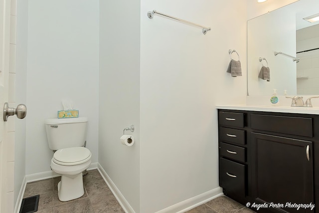 1708 Meadow Ln, Mchenry, IL 60050 - bathroom featuring toilet, vanity, baseboards, and tile patterned flooring