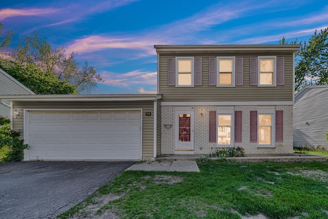 706 Shining Water Dr, Carol Stream, IL 60188 - colonial inspired home featuring asphalt driveway, a garage, a front lawn, and brick siding