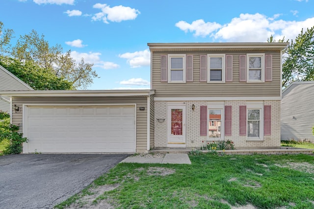 706 Shining Water Dr, Carol Stream, IL 60188 - colonial house with asphalt driveway, an attached garage, a front lawn, and brick siding
