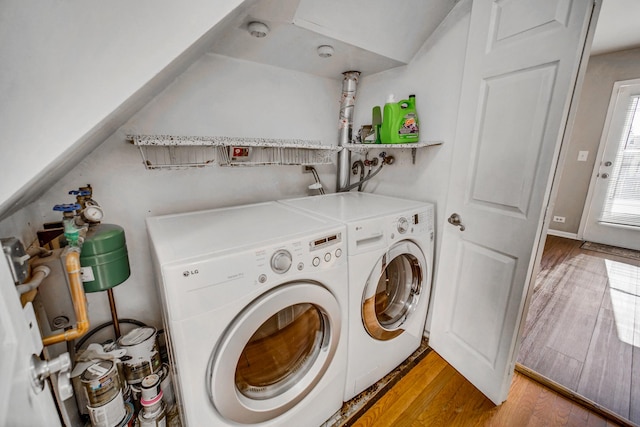 706 Shining Water Dr, Carol Stream, IL 60188 - clothes washing area with washing machine and dryer and light wood-style floors
