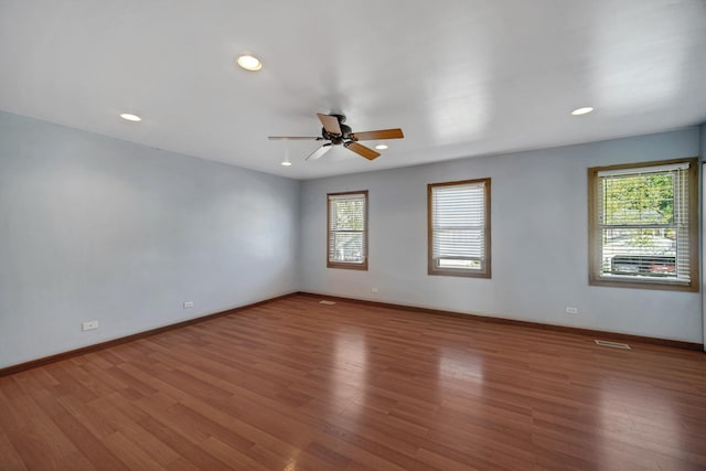 706 Shining Water Dr, Carol Stream, IL 60188 - spare room with plenty of natural light, ceiling fan, wood finished floors, recessed lighting, and baseboards