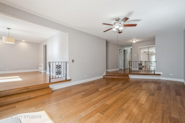 5251 W Galitz St Unit 309, Skokie, IL 60077 - unfurnished living room featuring ceiling fan, wood finished floors, and baseboards