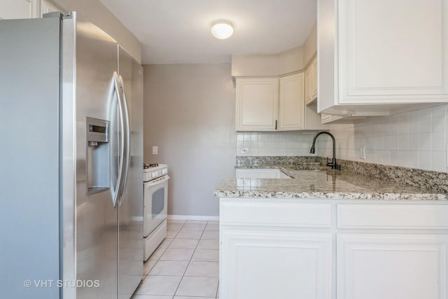 5251 W Galitz St Unit 309, Skokie, IL 60077 - kitchen featuring stainless steel fridge, a sink, white range with gas cooktop, light tile patterned floors, and light stone counters